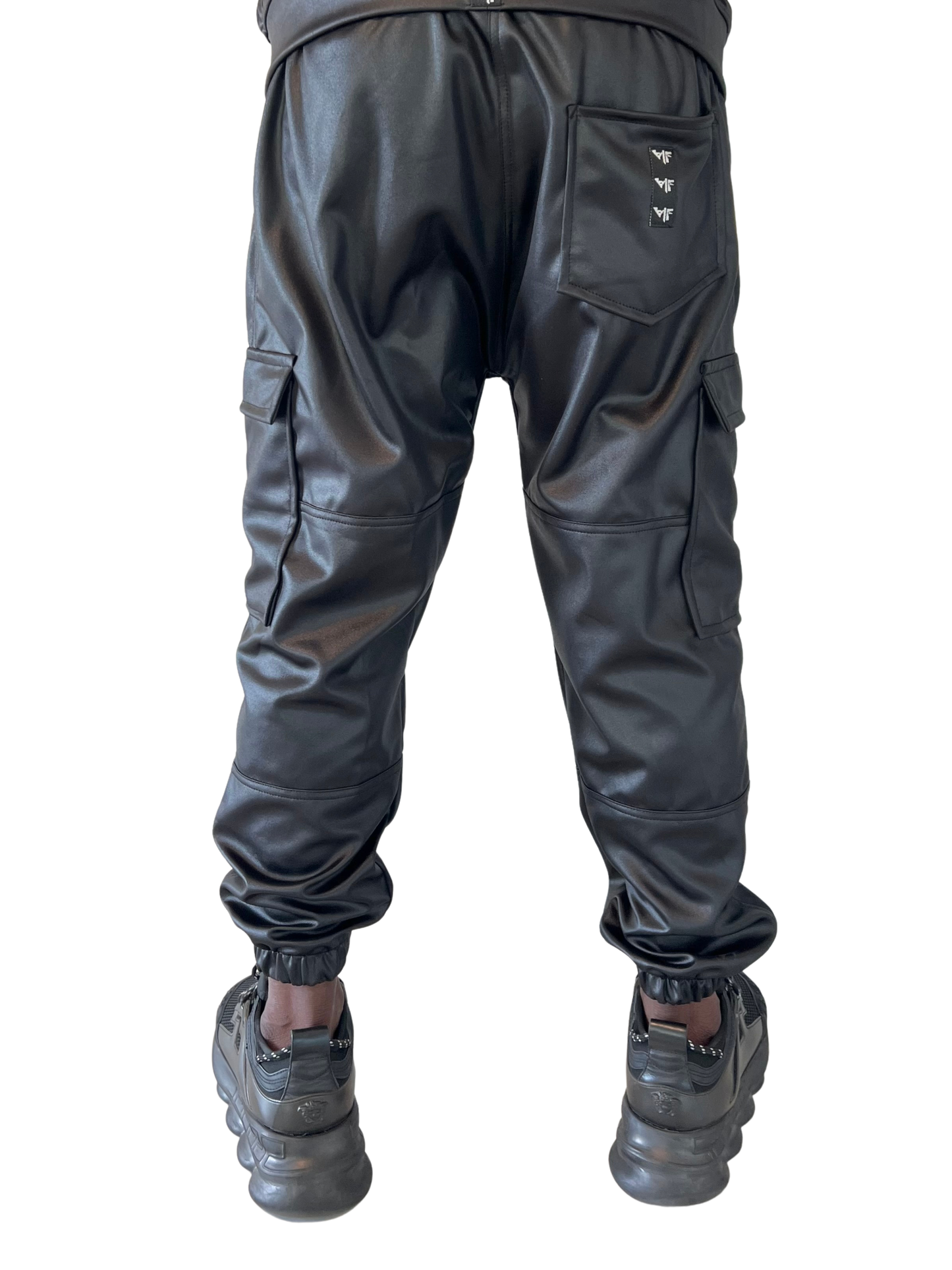 Pantaloni din material flexibil, de trening, cu buzunare laterale si elastec la glezna