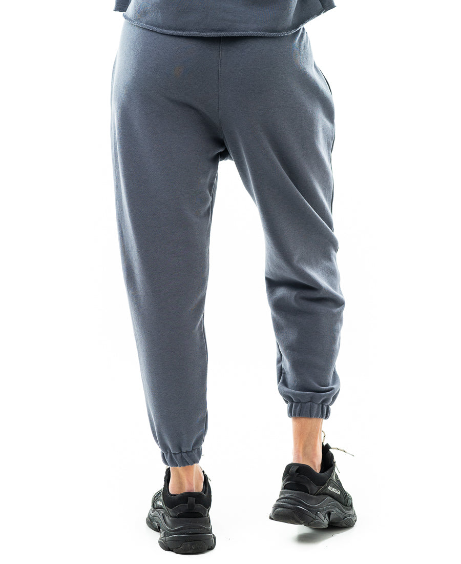 Pantaloni cu o taietura pe picior si elastec la glezna