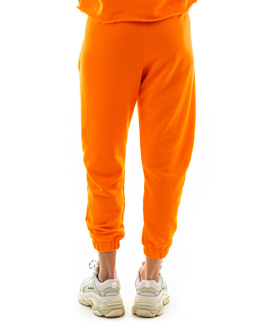 Pantaloni portocalii cu o taietura pe picior si elastec la glezna