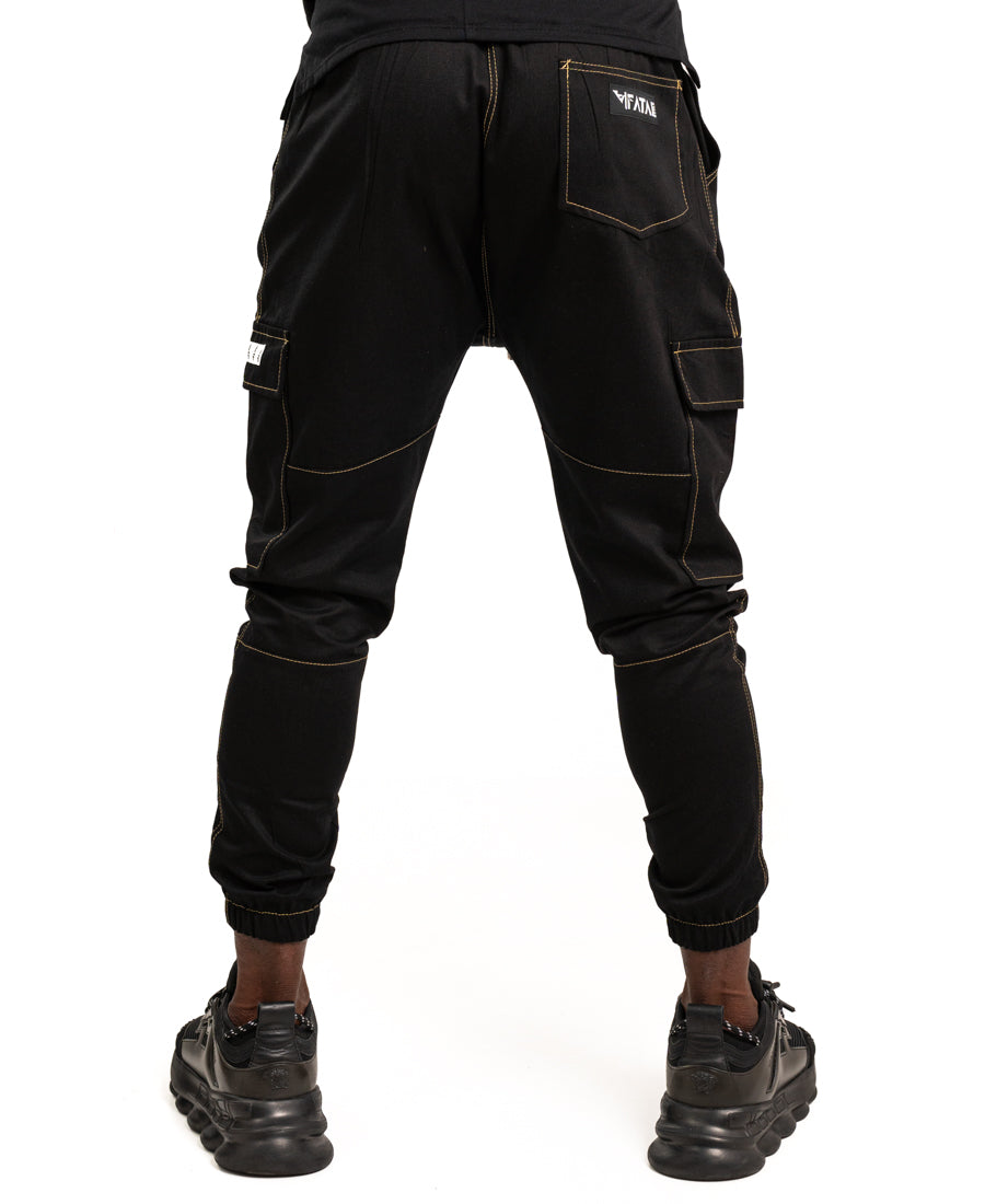 Pantaloni negri cu diverse cusaturi maro tip blugi