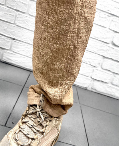 Pantaloni crem din material vaporos
