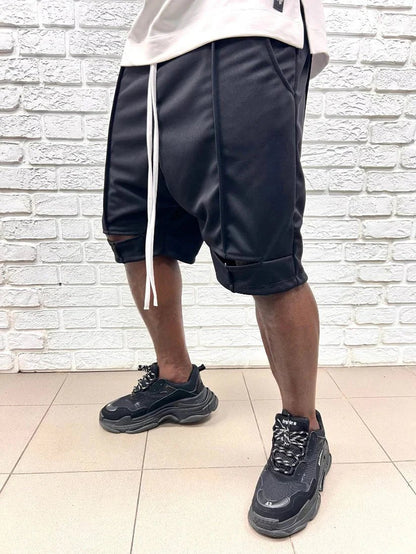 Pantaloni negri cu taietura la genunchi