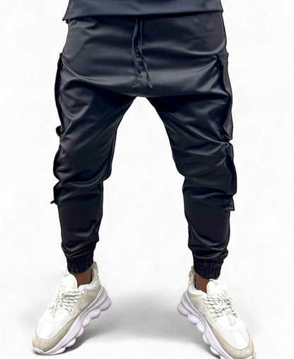 Pantaloni negri casul din material lucios cu buzunare laterale