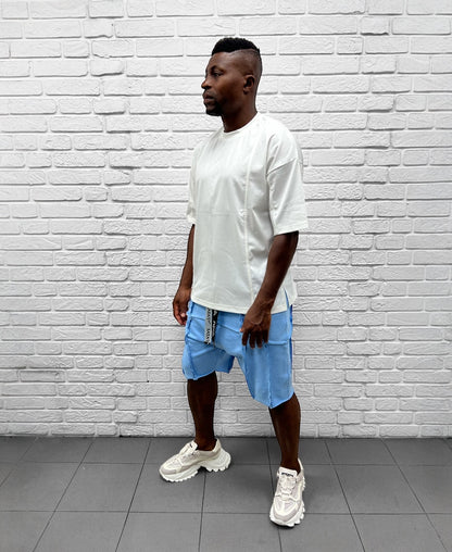 Pantaloni bleu cu multiple taieturi
