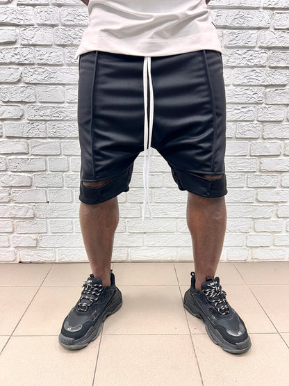 Pantaloni negri cu taietura la genunchi