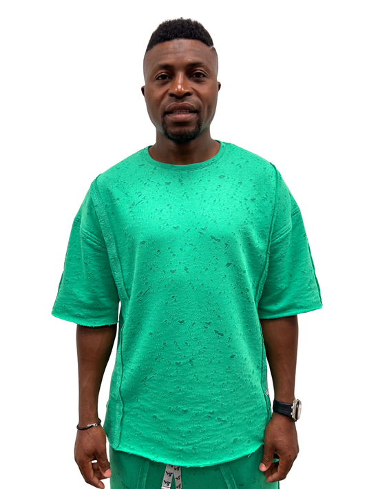 Tricou verde cu material perforat la suprafata ca design