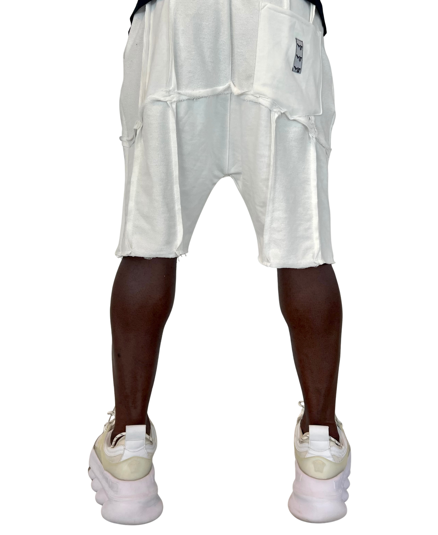 Pantaloni albi cu multiple taieturi