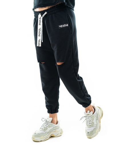 Pantaloni negri cu o taietura pe picior si elastec la glezna