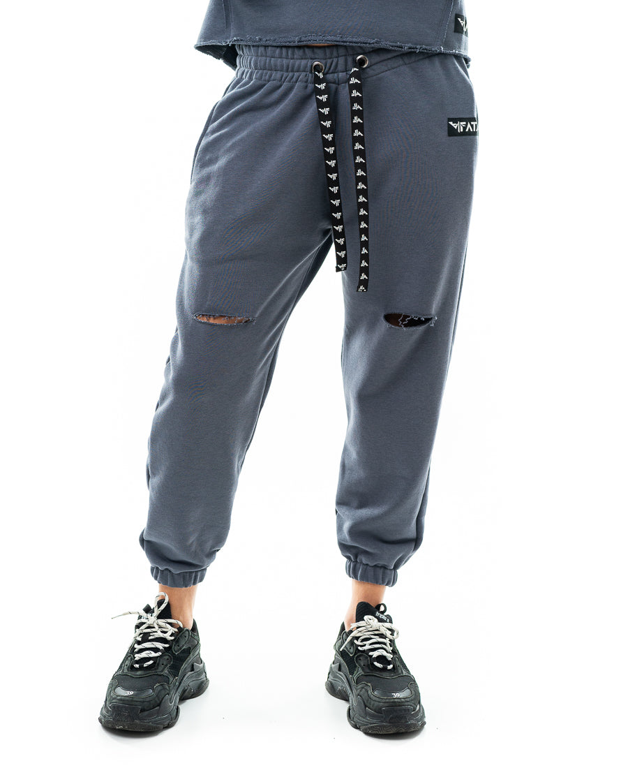 Pantaloni cu o taietura pe picior si elastec la glezna