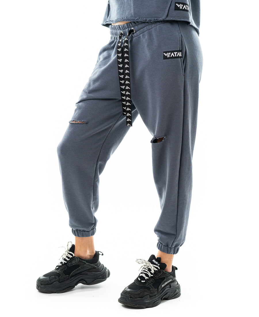 Pantaloni cu o taietura pe picior si elastec la glezna