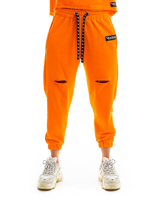 Pantaloni portocalii cu o taietura pe picior si elastec la glezna