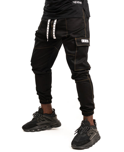 Pantaloni negri cu diverse cusaturi maro tip blugi