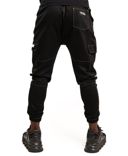 Pantaloni negri cu diverse cusaturi maro tip blugi